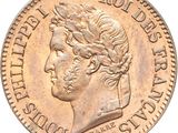 a close up of a coin with a man ' s head on it