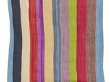 a multicolored striped rug on a white background