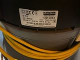 a yellow hose attached to a machine on the floor