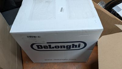 a box that is sitting on the floor next to a bike