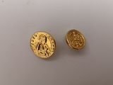 two gold coins, one of which is a roman coin and the other of which is a roman coin