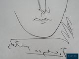 an image of a drawing of a man ' s face on a piece of paper