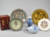 many plates and bowls that are sitting on a table
