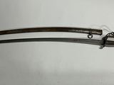 an old pair of swords on display on a white surface