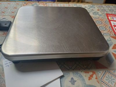 a laptop computer sitting on top of a piece of paper