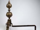 an antique brass candle holder on a stand with a handle