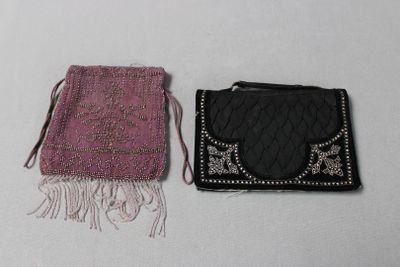two small purses sitting next to each other on a table