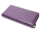 portefeuille en cuir violet muni d'une fermeture à glissière et d'une fermeture à glissière