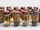 a lot of bottles of different kinds of spices