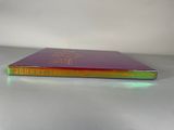 a close up of a book on a table with a white background