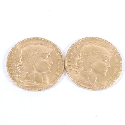 deux pièces d'or portant une tête de femme et une tête d'homme