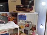two boxes on a table with a blender and a blender on it