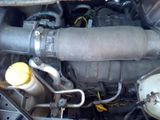 a close up of a car ' s engine with a yellow cap