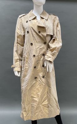 an image of a mannequin wearing a trench coat and hat