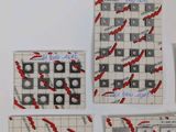 four pieces of paper with red and white designs on them