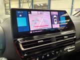a picture of a car dashboard with two monitors on it