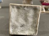a small white plate sitting on top of a table