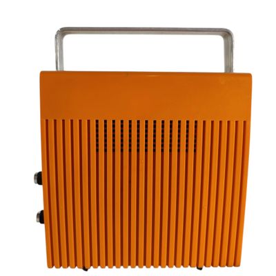 a close up of an orange radio sitting on top of a white surface