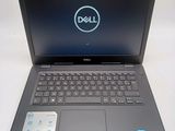 the dell laptop is open and ready to be used