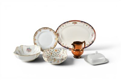 many different types of plates and bowls on the table