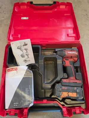 the tool kit is packed in a red case on the floor