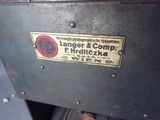 a sign on the back of a machine that says anger and comp