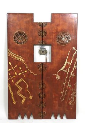 a wooden door that has a clock on it