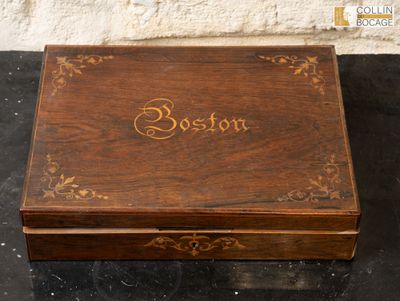 an old wooden box with the word boston written on it