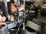 a pile of old tires and other items in a garage
