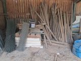 a pile of wood and a pile of wire in a shed