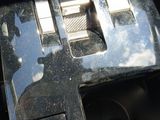 a car dashboard with a clock on it and a mirror on the dash