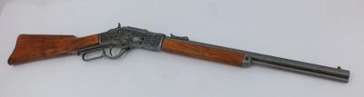 a gun that is laying on top of a table