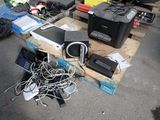 a pile of electronics on a pallet on the ground