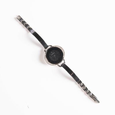 an image of a black and white watch on a white surface