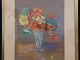 painting of orange and yellow flowers in a glass vase on a table