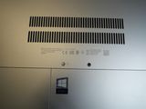 a close up of a silver laptop computer on a table