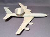 a model of a plane on a gray surface