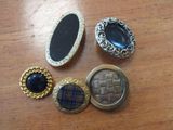 several different types of buttons are sitting on a table