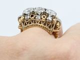 an image of a close up of a person ' s hand holding a ring