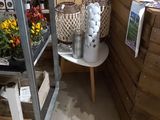 a shelf with a bunch of flowers on it in a room
