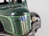 a close up of a toy truck with a badge on it