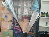 an image of a refrigerator in a room that is covered in aluminum foil