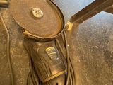 a sander and a drill on the floor in a room