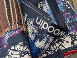 a close up of a tie with a tag on it