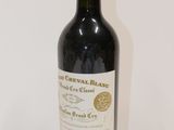 a bottle of wine that is sitting on a table