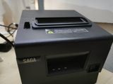a small printer sitting on top of a wooden table