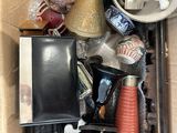 a cardboard box full of assorted items in it