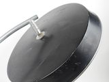 a black lamp that is on a white table