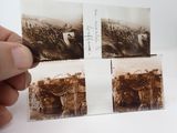 a hand holding a piece of paper with pictures of soldiers on it