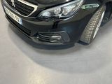 a picture of a black car in a showroom